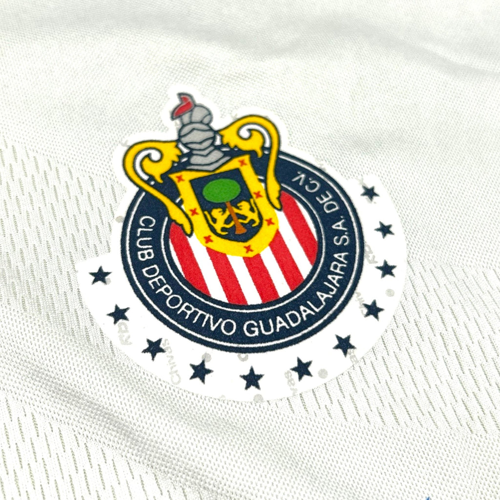ACOLDWASH vintage 2000s Chivas Guadalajara jersey crest detail on white fabric with embroidered stars