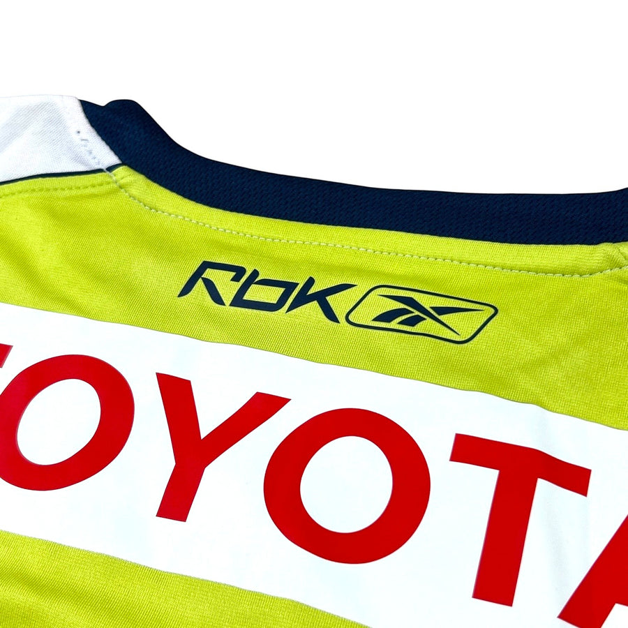 ACOLDWASH vintage 2000s Chivas Guadalajara away jersey in volt green with Toyota sponsor and Reebok logo detail.