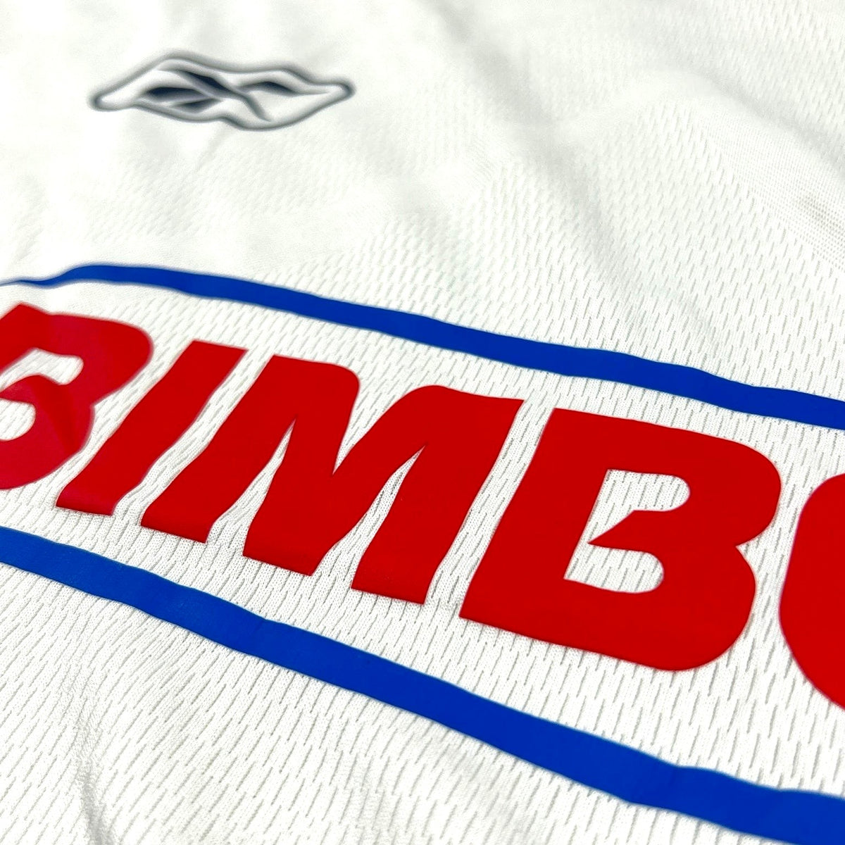 ACOLDWASH vintage 2000s Chivas Guadalajara away jersey featuring a white mesh fabric with a red Bimbo sponsor logo