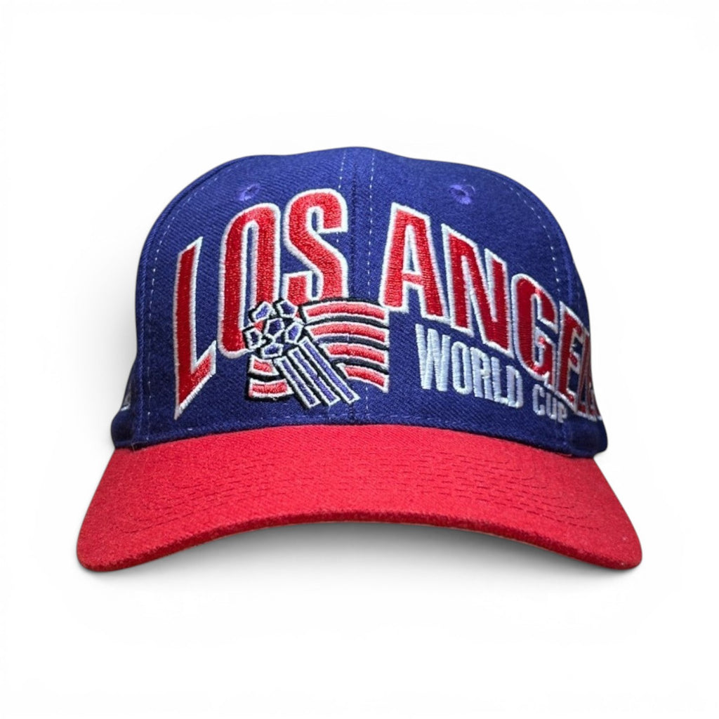 ACOLDWASH blue and red baseball cap with "LOS ANGELES WORLD CUP" embroidered on the front.