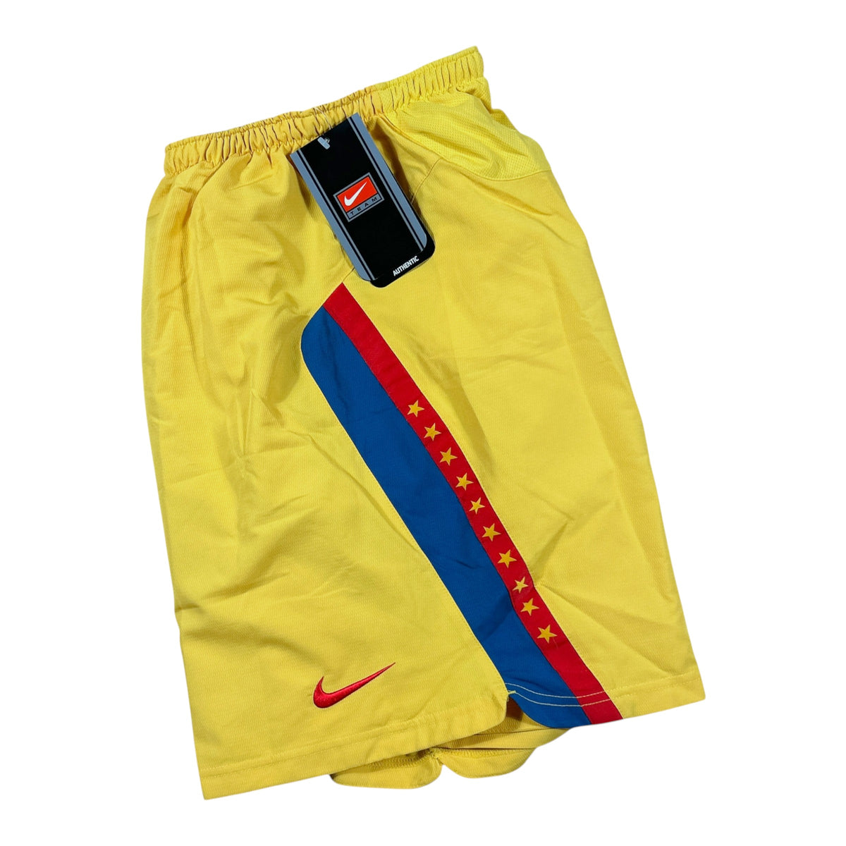 ACOLDWASH vintage 2005-06 Nike Club América football shorts in yellow with red and blue side panels and star detail.