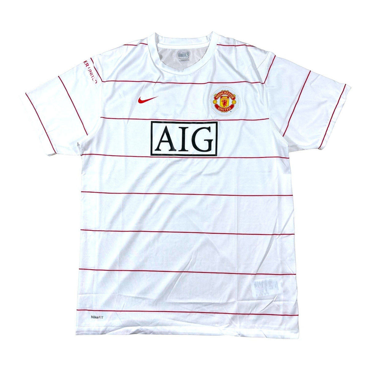 ACOLDWASH vintage 2008-09 Nike Manchester United white training shirt with red pinstripes and AIG sponsor logo.
