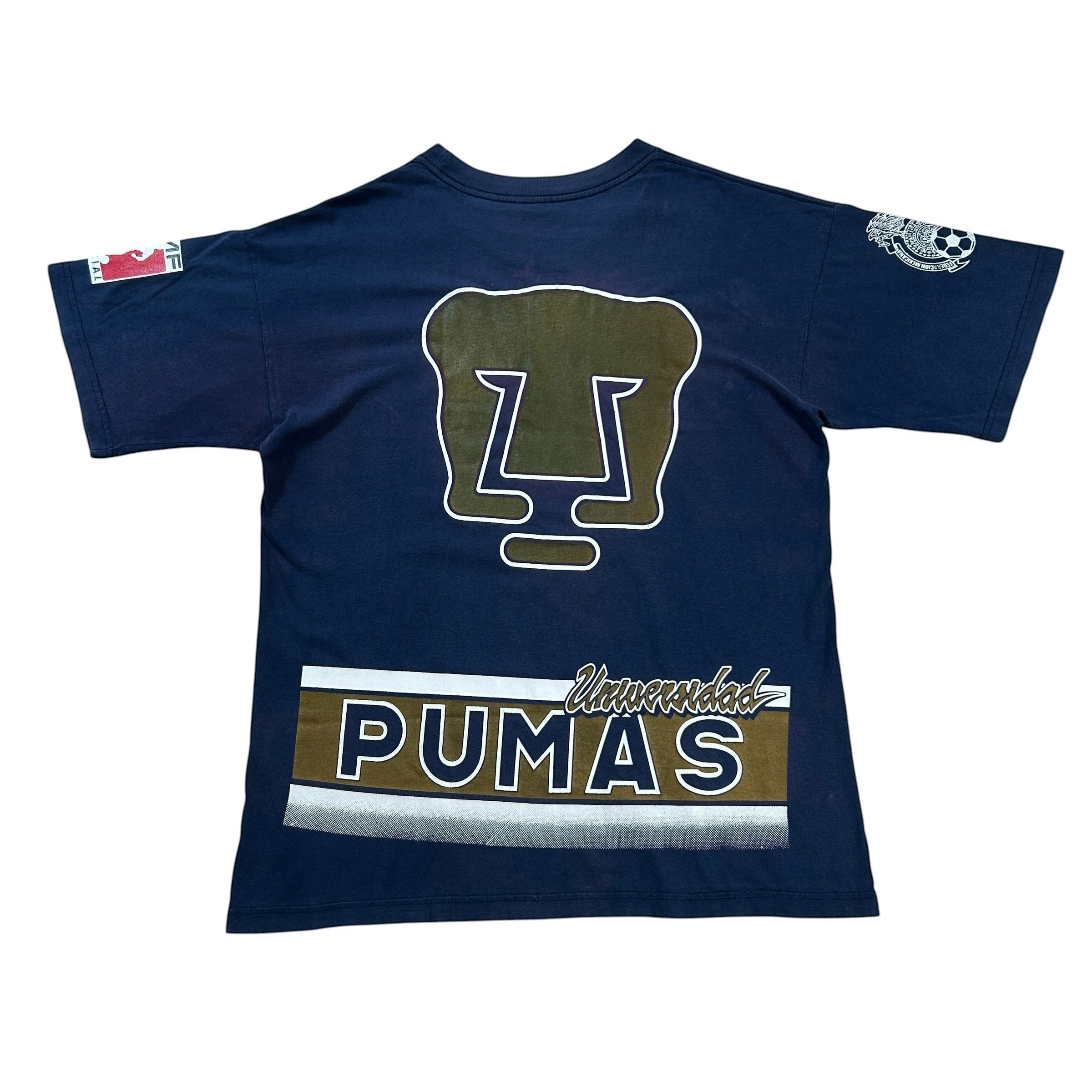 ACOLDWASH navy blue t-shirt with Pumas UNAM logo and "Pumas Universidad" graphic. Short sleeves, crew neck.
