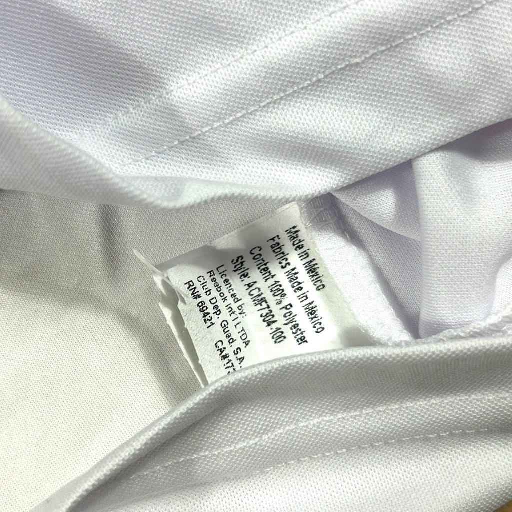 ACOLDWASH vintage Reebok Chivas Guadalajara jersey interior care tag showing polyester material and Mexico origin