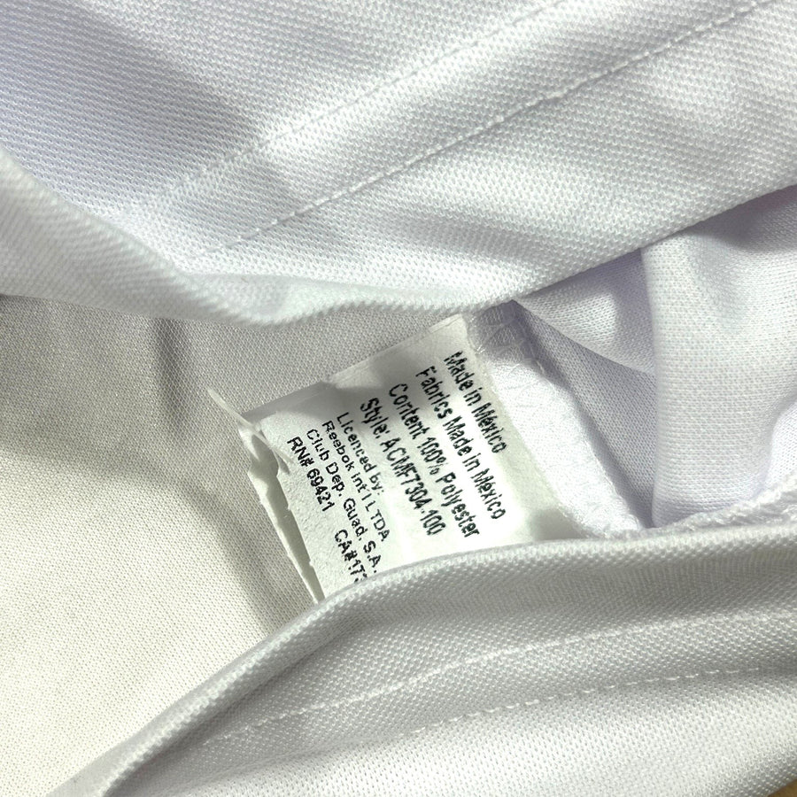 ACOLDWASH vintage Reebok Chivas Guadalajara jersey interior care tag showing polyester material and Mexico origin