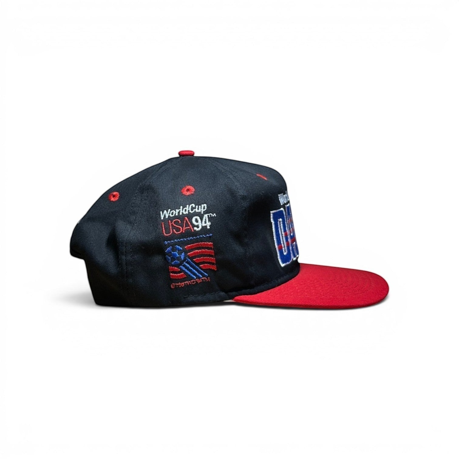 ACOLDWASH black snap cap with red brim, featuring World Cup USA 94 embroidery and Dallas text.