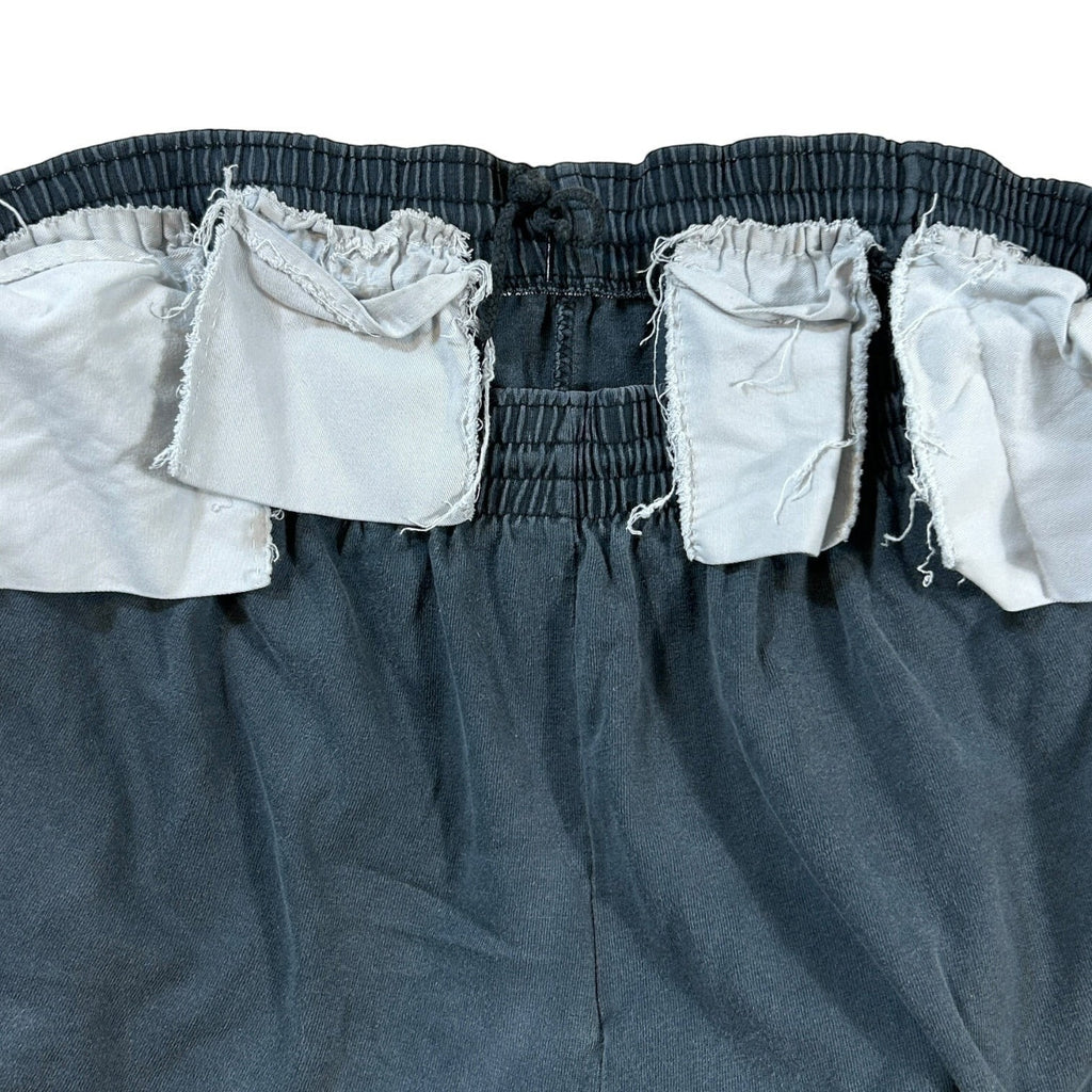 ACOLDWASH dark grey USA 94 Logo Flag shorts with elastic waistband and drawstring. Pockets are partially visible.
