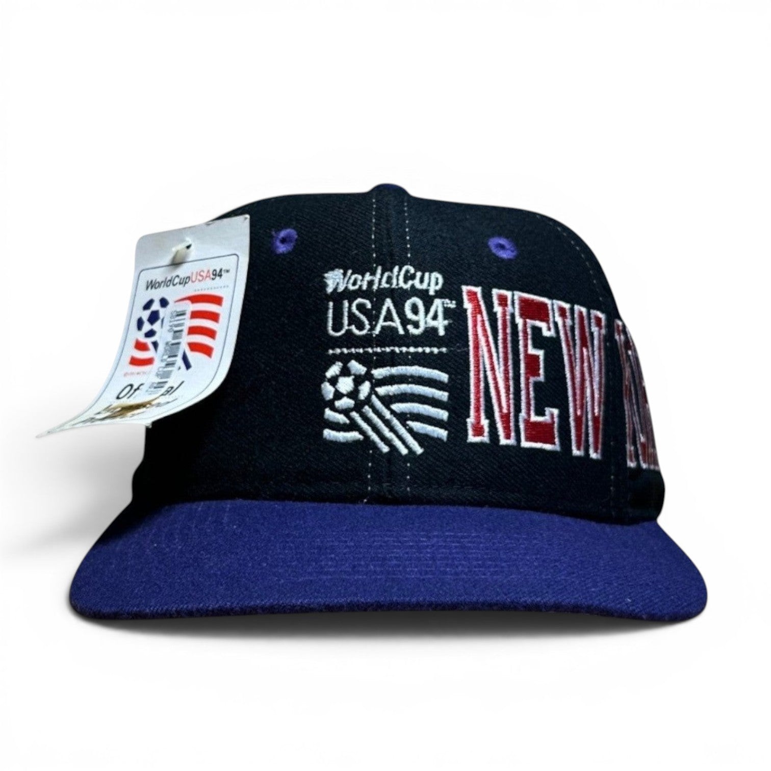 ACOLDWASH black snap cap with purple brim, embroidered "WorldCup USA94 NEW YORK" text and soccer ball graphic.