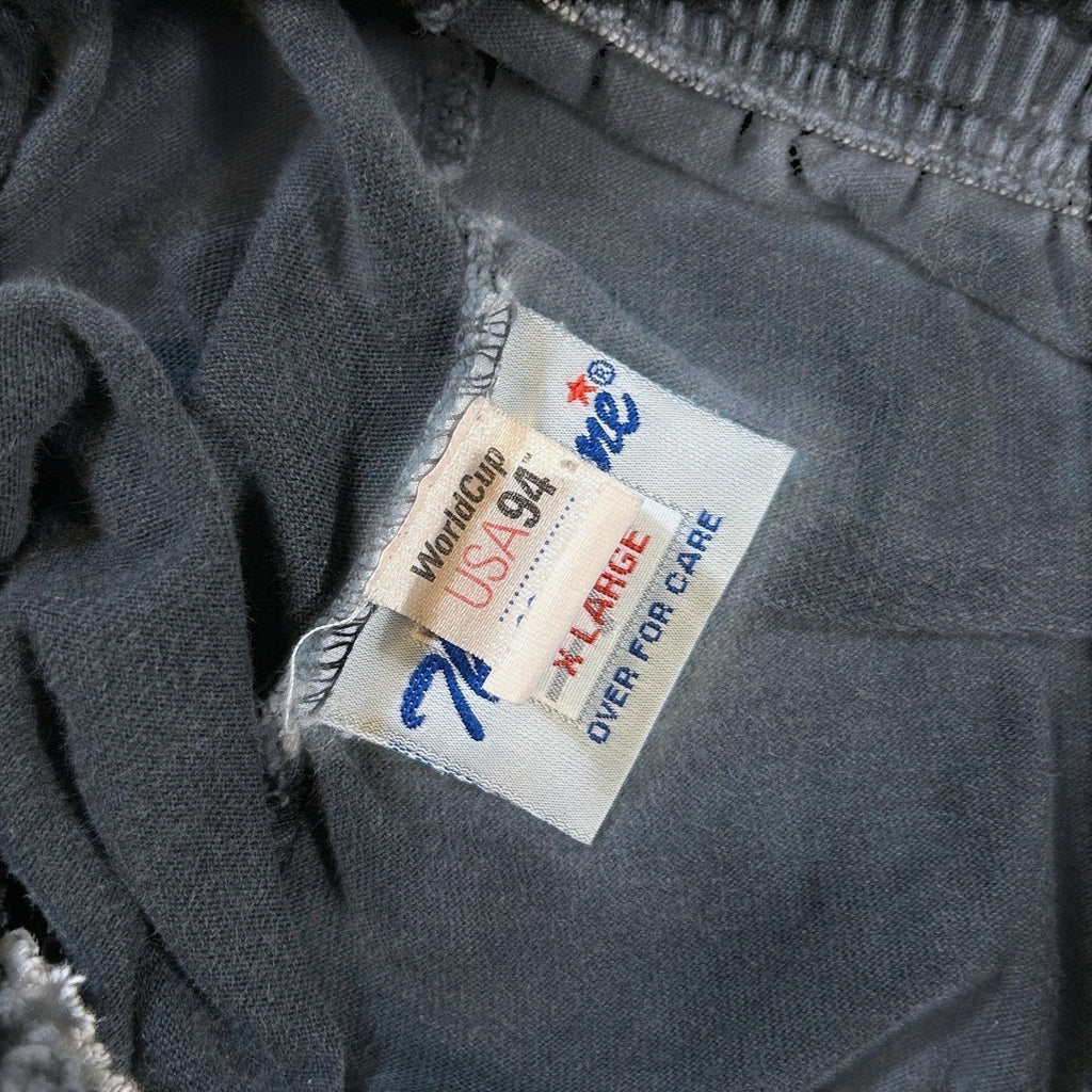 ACOLDWASH charcoal grey shorts with USA 94 World Cup logo tag and The Game brand tag.